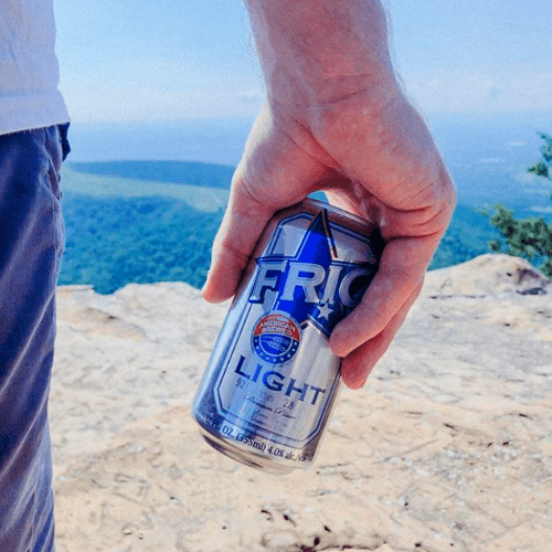 Low Calorie Light Enjoy FRIO Can held in hand